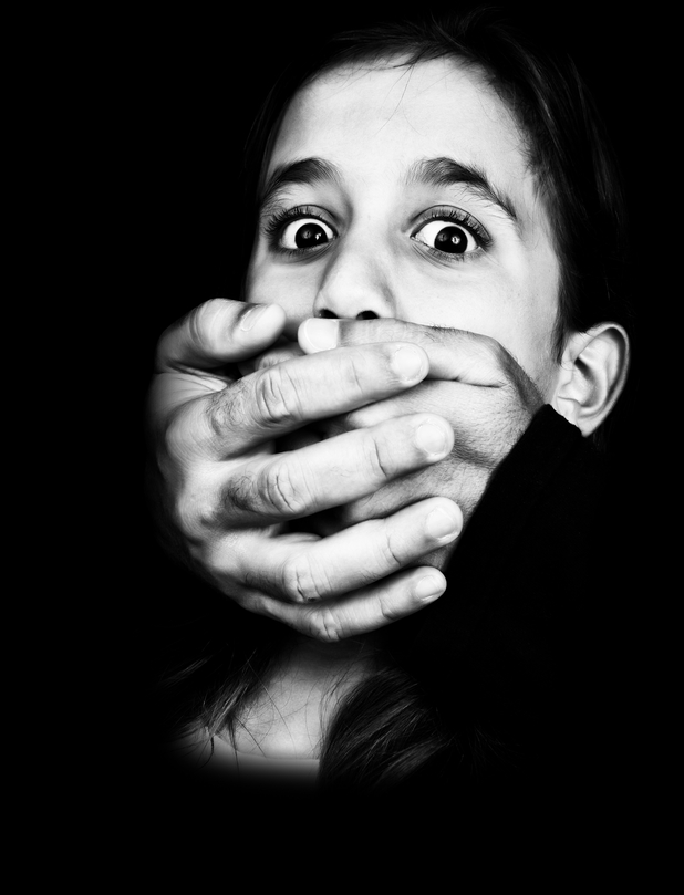 Black and white image of a child being abused and silenced